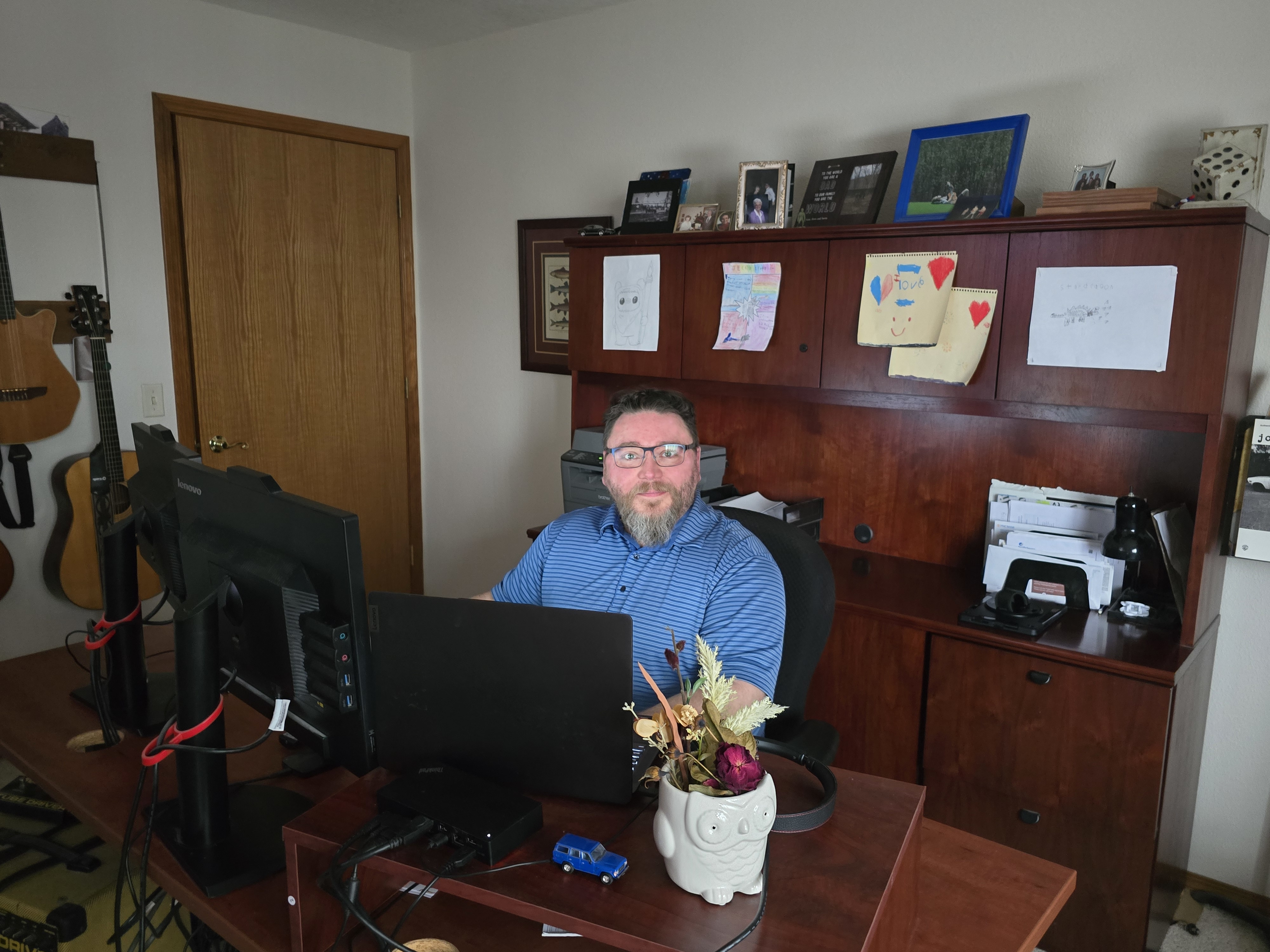 Photo of Timothy Fiser at his desk.